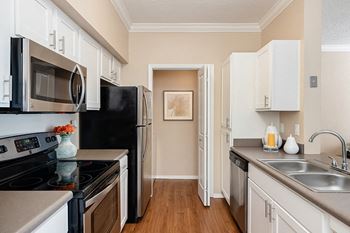 Fully-equipped kitchens with above-range microwaves and refrigerators with icemakers
